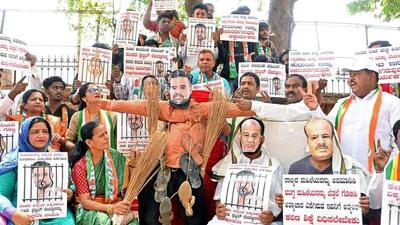 Congress supporters demanding arrest of JD(S) leaders. (ANI) Congress supporters demanding arrest of JD(S) leaders. (ANI)
