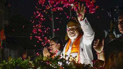 Guwahati: Union home minister and Amit Shah during a roadshow in support of party candidate in Guwahati on Monday (PTI) Guwahati: Union home minister and Amit Shah during a roadshow in support of party candidate in Guwahati on Monday (PTI)
