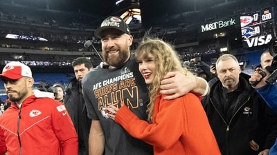 FILE - Kansas City Chiefs tight end Travis Kelce and Taylor Swift walk together after an AFC Championship NFL football game between the Chiefs and the Baltimore Ravens, Jan. 28, 2024, in Baltimore.. Taylor Swift, who is holding concerts in Japan, will make it in time for the Super Bowl to see her partner and football superstar Travis Kelce play. (AP Photo/Julio Cortez, File) (AP) FILE - Kansas City Chiefs tight end Travis Kelce and Taylor Swift walk together after an AFC Championship NFL football game between the Chiefs and the Baltimore Ravens, Jan. 28, 2024, in Baltimore.. Taylor Swift, who is holding concerts in Japan, will make it in time for the Super Bowl to see her partner and football superstar Travis Kelce play. (AP Photo/Julio Cortez, File) (AP)