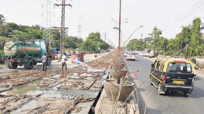 Kalyan,India May 16.2020. The work of widening and concretisation of the 21 km Kalyan - Shilphata road is carried out in full swing as the Maharashtra State Road Development Corporation has decided to use the lockdown period to carry out the work ,Photo of ongoing of work near main branch of DNS Bank Dombivli MIDC in Kalyan, India, on Saturday. May16.2020. (Photo by Rishikesh Choudhary/Hindustan Times) Kalyan,India May 16.2020. The work of widening and concretisation of the 21 km Kalyan - Shilphata road is carried out in full swing as the Maharashtra State Road Development Corporation has decided to use the lockdown period to carry out the work ,Photo of ongoing of work near main branch of DNS Bank Dombivli MIDC in Kalyan, India, on Saturday. May16.2020. (Photo by Rishikesh Choudhary/Hindustan Times)