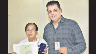 Kanhaiyalal Kataria (left) and Dipak Panjwani with the voter identity card and documents of Indian citizenship. (HT PHOTO) Kanhaiyalal Kataria (left) and Dipak Panjwani with the voter identity card and documents of Indian citizenship. (HT PHOTO)