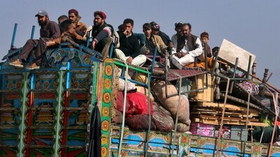 FILE - Afghan families onboard a truck head toward a border crossing point in Torkham, Pakistan, Tuesday, Oct. 31, 2023. For more than 1 million Afghans who fled war and poverty to Pakistan, these are uncertain times. (AP Photo/Muhammad Sajjad, File) (AP) FILE - Afghan families onboard a truck head toward a border crossing point in Torkham, Pakistan, Tuesday, Oct. 31, 2023. For more than 1 million Afghans who fled war and poverty to Pakistan, these are uncertain times. (AP Photo/Muhammad Sajjad, File) (AP)