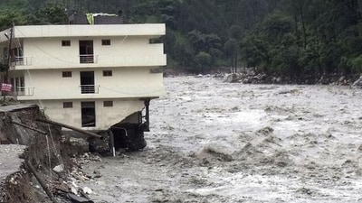 Part of a three storey building is washed away in flash floods in the Uttarkashi district, Uttarakhand. (AP/FILE) Part of a three storey building is washed away in flash floods in the Uttarkashi district, Uttarakhand. (AP/FILE)