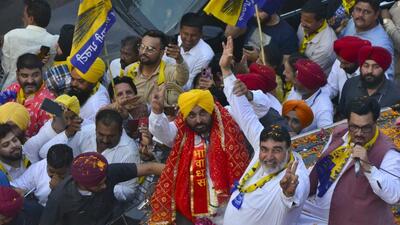 Punjab CM Bhagwant Mann and AAP candidate from Ludhiana Ashok Parashar Pappi during a roadshow. (Gurpreet Singh/HT)