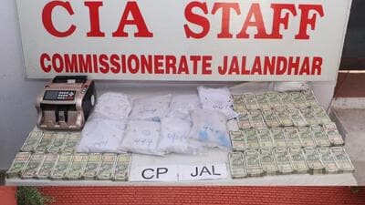 The packets of heroin and drug money recovered from the smugglers and (below) the vehicles from which the contraband was seized by the police in Jalandhar. The packets of heroin and drug money recovered from the smugglers and (below) the vehicles from which the contraband was seized by the police in Jalandhar.