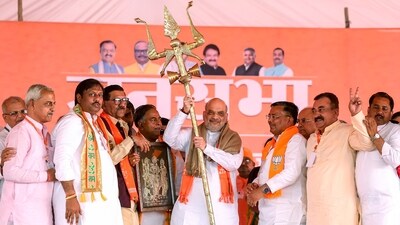 Union Home Minister Amit Shah being felicitated with 'Trishool' a trident during a public meeting ahead of the Lok Sabha polls, in Mainpuri on Sunday (Amit Shah X) Union Home Minister Amit Shah being felicitated with 'Trishool' a trident during a public meeting ahead of the Lok Sabha polls, in Mainpuri on Sunday (Amit Shah X)