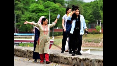 Visitors enjoying the cloudy weather at Sukhna Lake in Chandigarh on Monday. (Keshav SIngh/HT) Visitors enjoying the cloudy weather at Sukhna Lake in Chandigarh on Monday. (Keshav SIngh/HT)