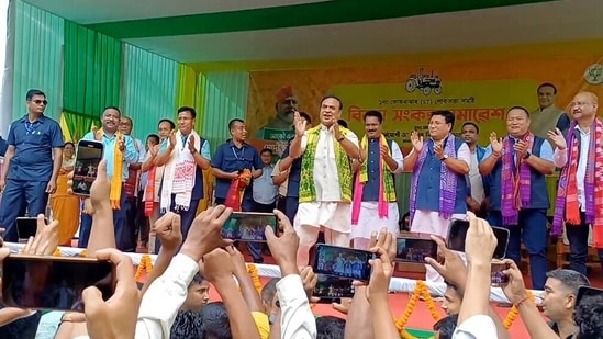 Assam CM Himanta Biswa Sarma dances with people during a public gathering, in Chirang, Assam.(ANI)