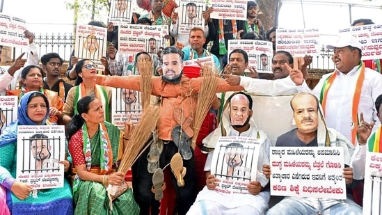 Congress workers stage a protest demanding the arrest of JD(S) MP Prajwal Revanna in Bengaluru on Sunday. (ANI)