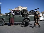 Afghanistan: Taliban fighters stand guard as they block a road near Kabul. Afghanistan: Taliban fighters stand guard as they block a road near Kabul.