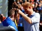 Prince Harry stands alone at the Invictus Games’ milestone event. REUTERS/Piroschka Van De Wouw/File Photo
