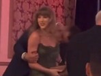 Taylor Swift received a bunch of kisses on her shoulder from Travis Kelce.