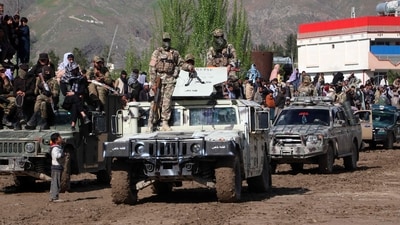 Taliban security personnel stand guard atop a Humevee vehicle in Fayzabad, Badakhshan province. (AFP)
