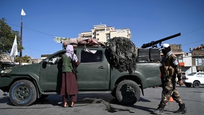 Afghanistan: Taliban fighters stand guard as they block a road near Kabul. (AFP) Afghanistan: Taliban fighters stand guard as they block a road near Kabul. (AFP)