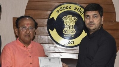 BJP's Surat Lok Sabha candidate Mukesh Dalal (left) receiving his election certificate. (PTI) BJP's Surat Lok Sabha candidate Mukesh Dalal (left) receiving his election certificate. (PTI)
