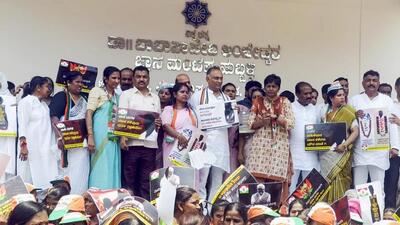 Mahila Congress members with party MLA and other leaders during a protest against JD(S) MP Prajwal Revanna on his alleged involvement in sexual abuse, in Hubballi, on Tuesday. (PTI) Mahila Congress members with party MLA and other leaders during a protest against JD(S) MP Prajwal Revanna on his alleged involvement in sexual abuse, in Hubballi, on Tuesday. (PTI)