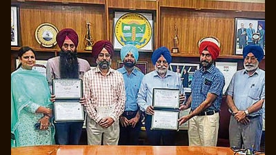 PAU vice-chancellor Satbir Singh Gosal along with the researchers who got the awards. (HT Photo) PAU vice-chancellor Satbir Singh Gosal along with the researchers who got the awards. (HT Photo)