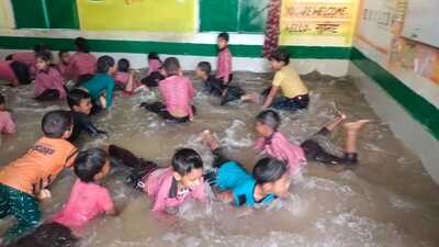 Students of model primary school in Kannauj district enjoying themselves in the classroom pool. (Sourced) Students of model primary school in Kannauj district enjoying themselves in the classroom pool. (Sourced)