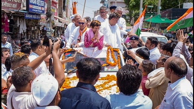 The presence of Rajya Sabha MP Randeep Singh Surjewala and former Hisar MP Brijendra Singh were also present in the roadshow. (PTI) The presence of Rajya Sabha MP Randeep Singh Surjewala and former Hisar MP Brijendra Singh were also present in the roadshow. (PTI)