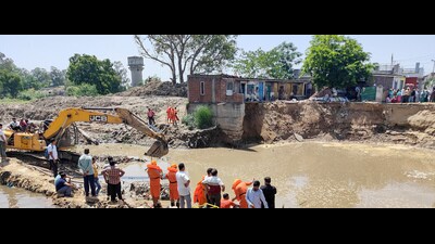 The rescue operation is underway after a man drowned in a nullah (drain) following flash floods triggered by heavy rainfall, at Gadi Garh in Jammu on Tuesday. (ANI) The rescue operation is underway after a man drowned in a nullah (drain) following flash floods triggered by heavy rainfall, at Gadi Garh in Jammu on Tuesday. (ANI)