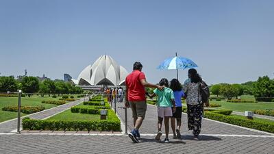 Visitors at Lotus Temple in New Delhi on Tuesday. (Raj K Raj/HT Photo) Visitors at Lotus Temple in New Delhi on Tuesday. (Raj K Raj/HT Photo)