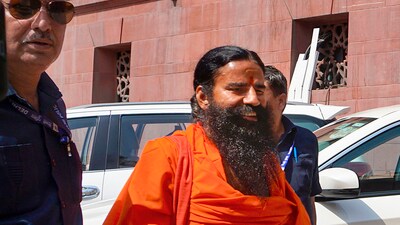Ramdev at the Supreme Court for hearing on the Patanjali misleading advertisements case. (PTI) Ramdev at the Supreme Court for hearing on the Patanjali misleading advertisements case. (PTI)