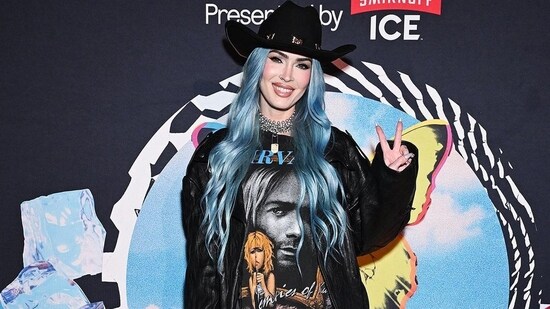 Megan Fox embraces cowboycore with mermaid hair, black tee, leather jacket, boots and a hat (Photo: Instagram)