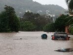 A car stands in the flooding water of the Taquari River during heavy rains in the city of Encantado in Rio Grande do Sul, Brazil.