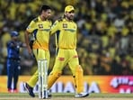Chennai Super Kings' MS Dhoni talks with his teammate Mustafizur Rahman (L) 