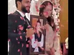 Snapshot of the bride and groom with a picture of Imran Khan. Snapshot of the bride and groom with a picture of Imran Khan.