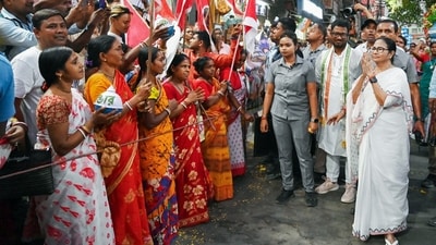 West Bengal CM and TMC chief Mamata Banerjee greets people during an election campaign in Malda, West Bengal. (ANI) West Bengal CM and TMC chief Mamata Banerjee greets people during an election campaign in Malda, West Bengal. (ANI)