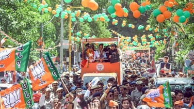 Defence Minister Rajnath Singh during a roadshow in support of BJP candidate Manoj Tiwari, in New Delhi. (ANI) Defence Minister Rajnath Singh during a roadshow in support of BJP candidate Manoj Tiwari, in New Delhi. (ANI)