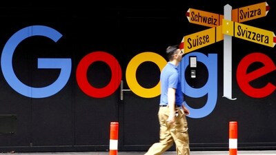 Google layoffs: A man walks past a logo of Alphabet Inc's Google in front of an office building in Zurich, Switzerland. (Reuters)