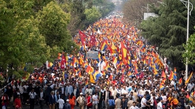Supporters of Rastriya Prajatantra Party, or national democratic party, wave their flags as they take part in a protest demanding a restoration of Nepal's monarchy in Kathmandu, Nepal, Tuesday, April 9, 2024. AP/PTI(AP04_09_2024_000138B) (AP) Supporters of Rastriya Prajatantra Party, or national democratic party, wave their flags as they take part in a protest demanding a restoration of Nepal's monarchy in Kathmandu, Nepal, Tuesday, April 9, 2024. AP/PTI(AP04_09_2024_000138B) (AP)