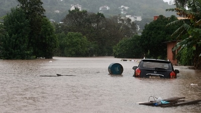 A car stands in the flooding water of the Taquari River during heavy rains in the city of Encantado in Rio Grande do Sul, Brazil. (REUTERS)