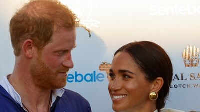 Britain's Prince Harry and Meghan, Duchess of Sussex, look at each other as they attend the Royal Salute Polo Challenge to benefit Sentebale, in Wellington, Florida, U.S., April 12, 2024.  REUTERS/Marco Bello (REUTERS)