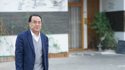 Virologist Zhang Yongzhen, the first scientist to publish a sequence of the COVID-19 virus, walks down a street in Shanghai, China on Dec. 13, 2020. (AP)