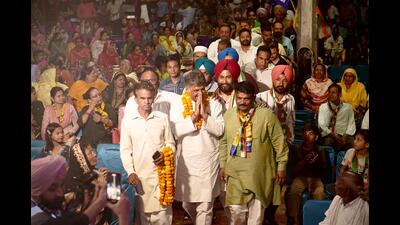 Congress candidate Manish Tewari during his campaign at Bapu Dham Colony on Wednesday. (HT photo)