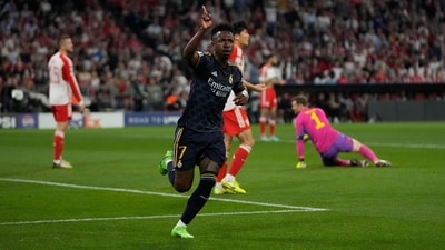 Real Madrid's Vinicius Junior celebrates after scoring his side's opening goal during the Champions League semifinal first leg soccer match between Bayern Munich and Real Madrid at the Allianz Arena in Munich (AP) Real Madrid's Vinicius Junior celebrates after scoring his side's opening goal during the Champions League semifinal first leg soccer match between Bayern Munich and Real Madrid at the Allianz Arena in Munich (AP)