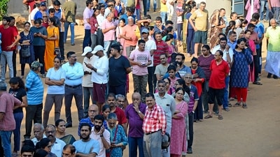 People queue up to vote during the second round of voting in the six-week long national election outside a polling booth in Bengaluru, India, Friday, April 26, 2024. (AP Photo) (AP) People queue up to vote during the second round of voting in the six-week long national election outside a polling booth in Bengaluru, India, Friday, April 26, 2024. (AP Photo) (AP)