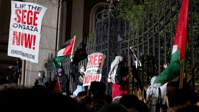 Pro-Palestianian protesters gather near a main gate at Columbia University in New York, Tuesday, April 30, 2024, just before New York City police officers cleared the area after a building was taken over by protesters earlier in the day. The building and a tent encampment were cleared during the operation. (AP Photo/Craig Ruttle) (AP) Pro-Palestianian protesters gather near a main gate at Columbia University in New York, Tuesday, April 30, 2024, just before New York City police officers cleared the area after a building was taken over by protesters earlier in the day. The building and a tent encampment were cleared during the operation. (AP Photo/Craig Ruttle) (AP)
