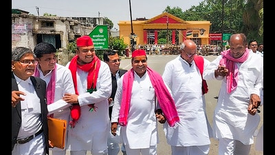 Samajwadi Party candidate Dharmendra Yadav (C) arrives to file his nomination papers for Lok Sabha polls, in Azamgarh, Wednesday (PTI)
