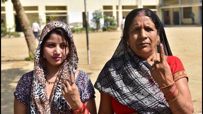 Two women voters show their inked fingers after casting vote during the second phase of the Loksabha elections in Ghaziabad on April 26. (Photo by Sakib Ali /Hindustan Times) Two women voters show their inked fingers after casting vote during the second phase of the Loksabha elections in Ghaziabad on April 26. (Photo by Sakib Ali /Hindustan Times)