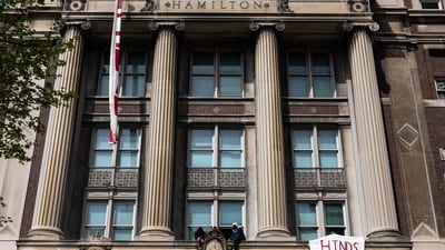 Pro-Palestinian protesters who are occupying Hamilton Hall sit on a ledge as they look at a crowd at Columbia University on April 30, 2024 in New York City. Columbia University had restricted access to the school's campus to students residing in residential buildings on campus and employees who provide essential services to campus buildings after protestors took over Hamilton Hall overnight renaming it as "Hind's Hall" in honor of Hind Rajab. (Getty Images via AFP) Pro-Palestinian protesters who are occupying Hamilton Hall sit on a ledge as they look at a crowd at Columbia University on April 30, 2024 in New York City. Columbia University had restricted access to the school's campus to students residing in residential buildings on campus and employees who provide essential services to campus buildings after protestors took over Hamilton Hall overnight renaming it as "Hind's Hall" in honor of Hind Rajab. (Getty Images via AFP)