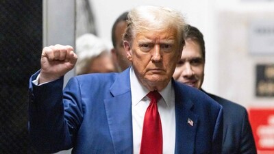 Former US President Donald Trump gestures as he walks back to the courtroom after a break in his trial for allegedly covering up hush money payments linked to extramarital affairs, at Manhattan Criminal Court in New York City, on April 30, 2024. Judge Juan Merchan, presiding over Donald Trump's hush money trial, fined the former president on Tuesday for defying a gag order and warned that further violations could result in jail time. (Photo by JUSTIN LANE / POOL / AFP) (AFP) Former US President Donald Trump gestures as he walks back to the courtroom after a break in his trial for allegedly covering up hush money payments linked to extramarital affairs, at Manhattan Criminal Court in New York City, on April 30, 2024. Judge Juan Merchan, presiding over Donald Trump's hush money trial, fined the former president on Tuesday for defying a gag order and warned that further violations could result in jail time. (Photo by JUSTIN LANE / POOL / AFP) (AFP)