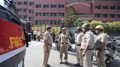 Police and fire department personnel outside Mother Mary's School at Mayur Vihar after multiple schools received a bomb threat in Delhi-NCR (PTI)