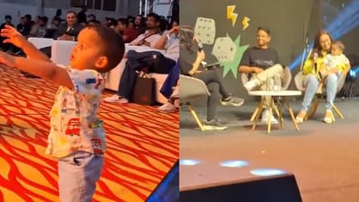 Snapshot of Radhika Gupta's son trying to climb the stage. Snapshot of Radhika Gupta's son trying to climb the stage.