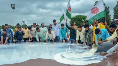 Swabhimani Shetkari Sanghatana activists pour milk at the memorial of Maharashtra's first chief minister late YB Chavan during a protest to demand direct ₹5 subsidy per litre. (PTI Photo) Swabhimani Shetkari Sanghatana activists pour milk at the memorial of Maharashtra's first chief minister late YB Chavan during a protest to demand direct ₹5 subsidy per litre. (PTI Photo)