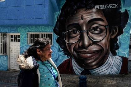 Tourists are flocking to Ciudad Bolivar to ride the TransMiCable cable car, visit the 'Street of Color' with vibrant murals, and explore the 'Self-Built City' museum. (AFP) Tourists are flocking to Ciudad Bolivar to ride the TransMiCable cable car, visit the 'Street of Color' with vibrant murals, and explore the 'Self-Built City' museum. (AFP)