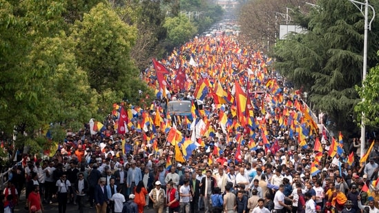 Supporters of Rastriya Prajatantra Party, or national democratic party, wave their flags as they take part in a protest demanding a restoration of Nepal's monarchy in Kathmandu, Nepal, Tuesday, April 9, 2024. AP/PTI(AP04_09_2024_000138B) (AP)
